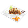 Buffalo wings - A large portion served with celery, carrots, blue cheese and barbecue sauces photo